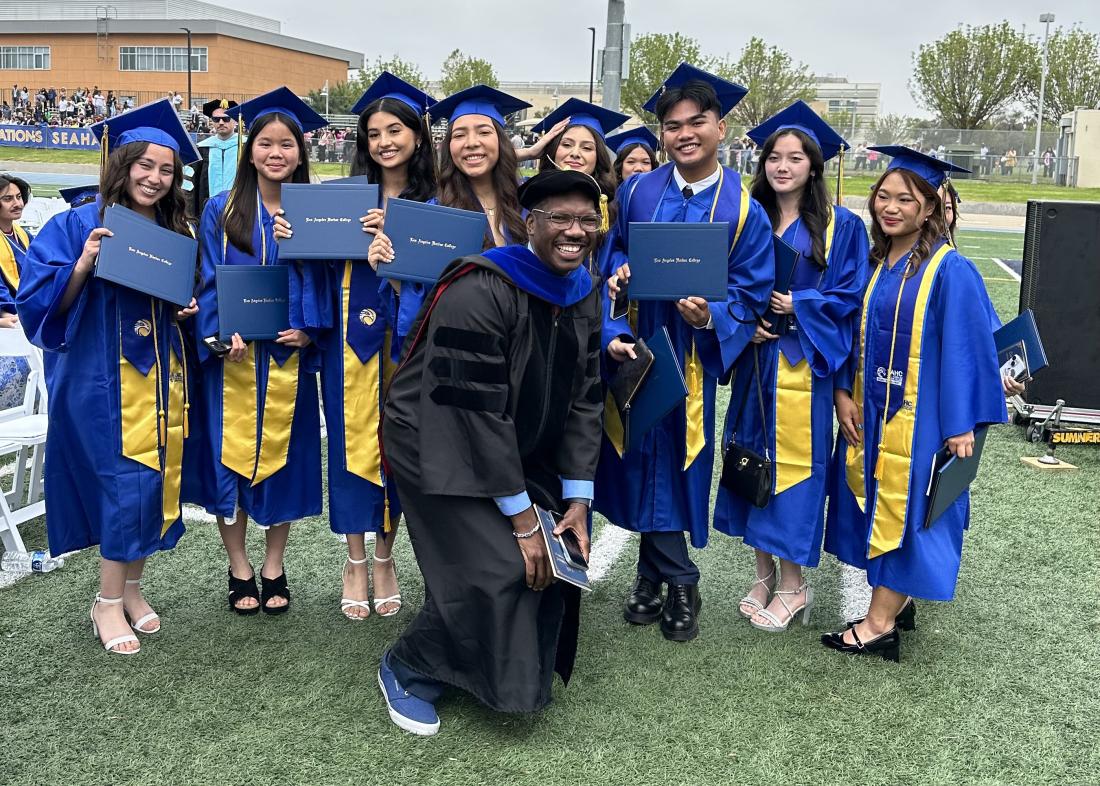 Professor O’Neil Wright Celebrates with Dual Enrollment Students at Graduation.