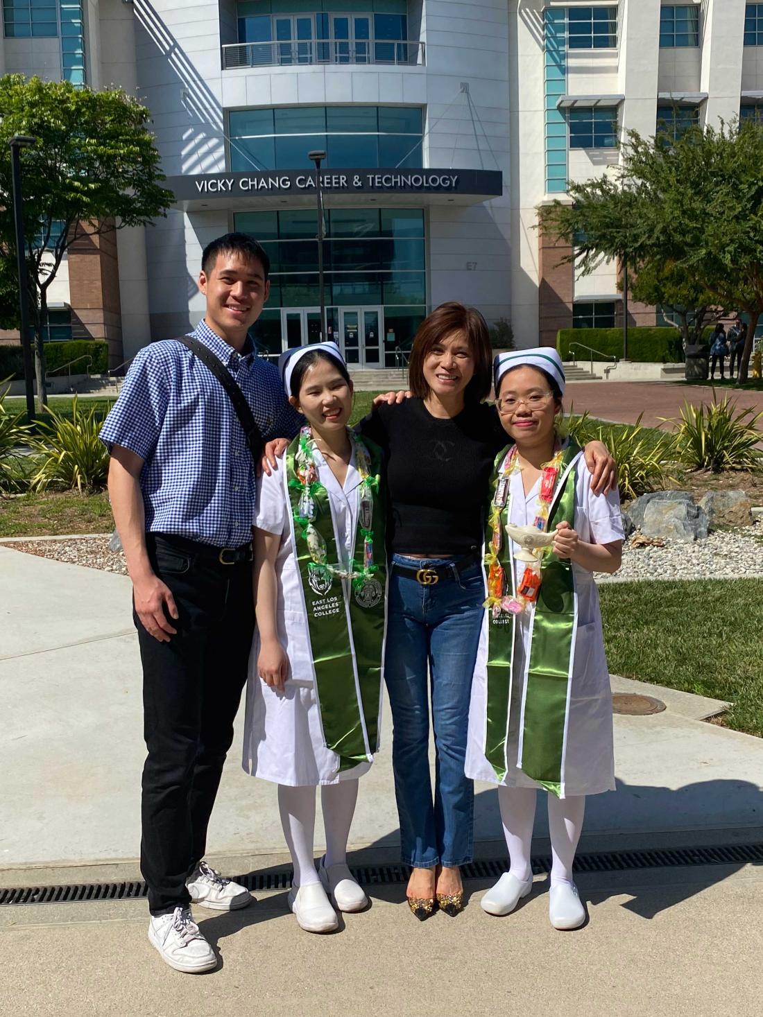 Ms. Chang, center, with son (left) and ELAC nursing graduates, June 2024