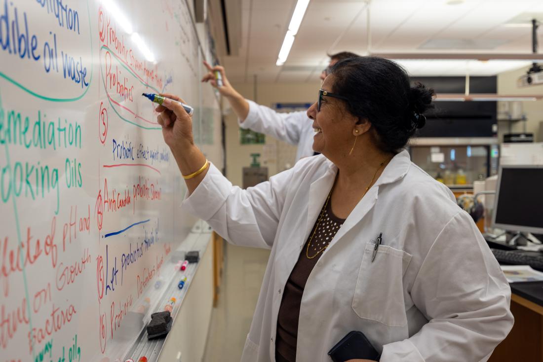 Dr. Chander Aurora leading a biotechnology class.