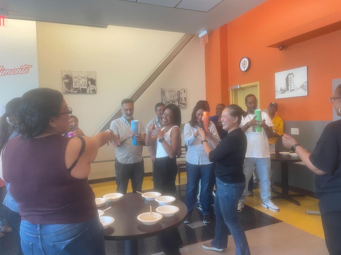 Classified staff having friendly competitions at Caring Wildcats Coffee Break